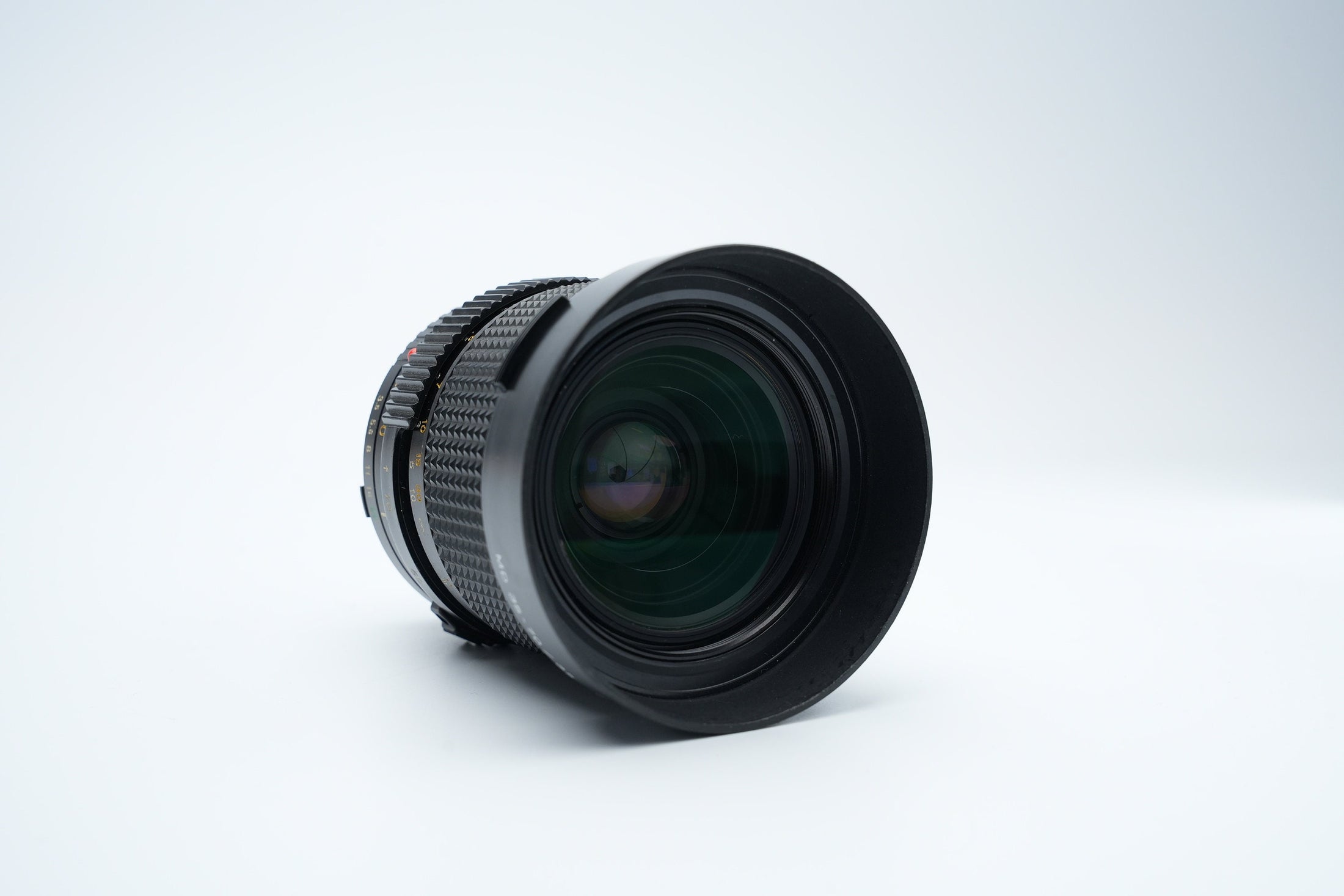 Minolta MD 35-70mm f/3.5 Macro Zoom Lens met Zonnekap