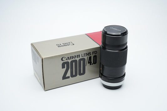 Canon FD 200mm f/4 S.S.C. Telelens - Iconische Optiek met Reinigingspotentieel