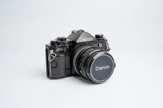 Canon A-1 Zwart – Vintage 35mm SLR met Canon FD 50mm f/1.8 Lens – Getest en Werkend