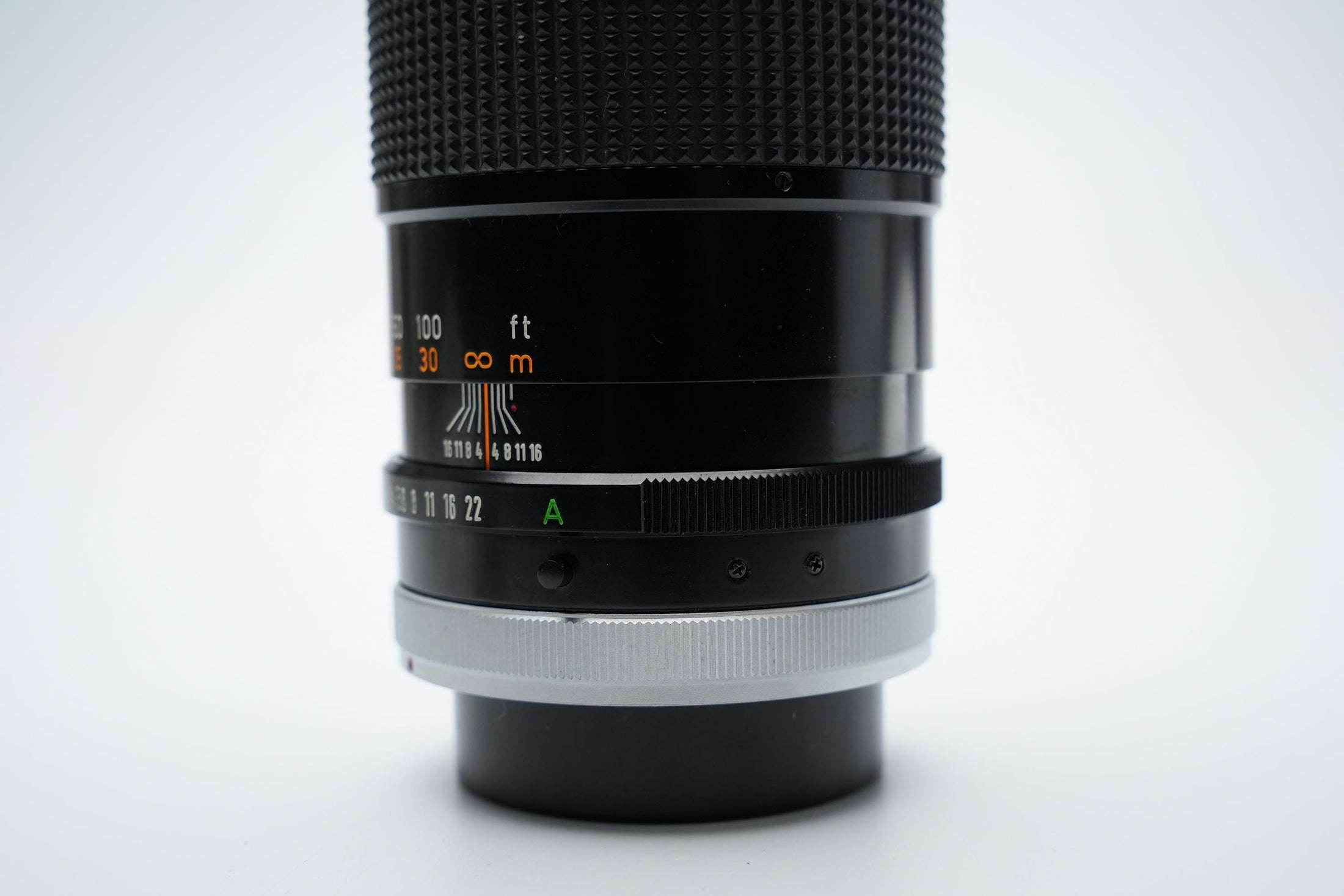 Canon FD 200mm f/4 S.S.C. Telelens - Iconische Optiek met Reinigingspotentieel