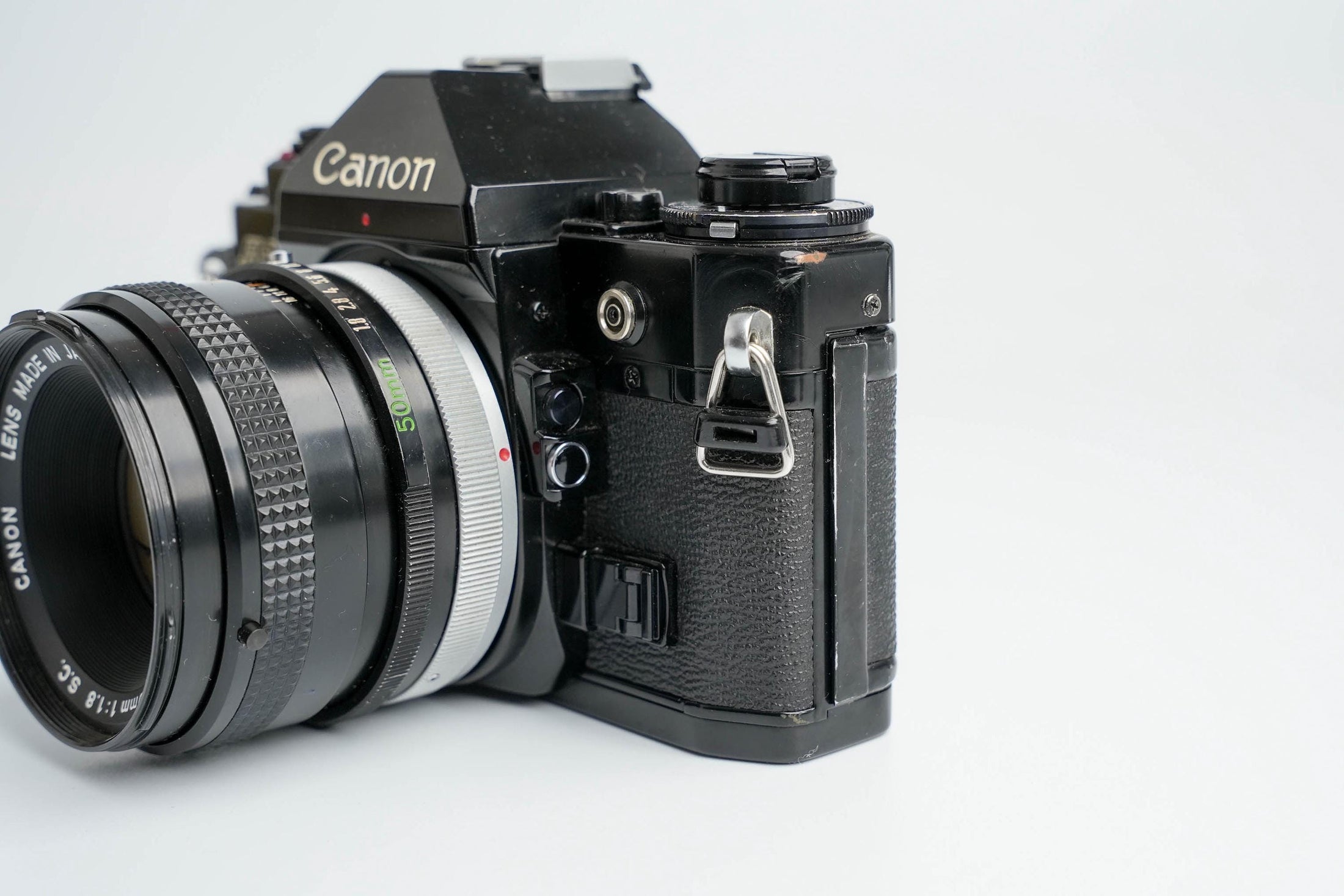 Canon A-1 Zwart – Vintage 35mm SLR met Canon FD 50mm f/1.8 Lens – Getest en Werkend
