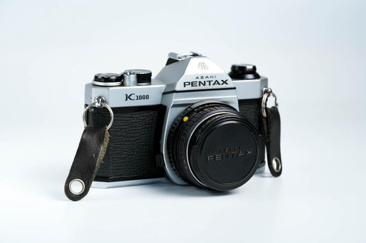 Pentax K1000 + SMC Pentax-M 50mm f/1.7 – Volledig werkend + gratis 35mm film