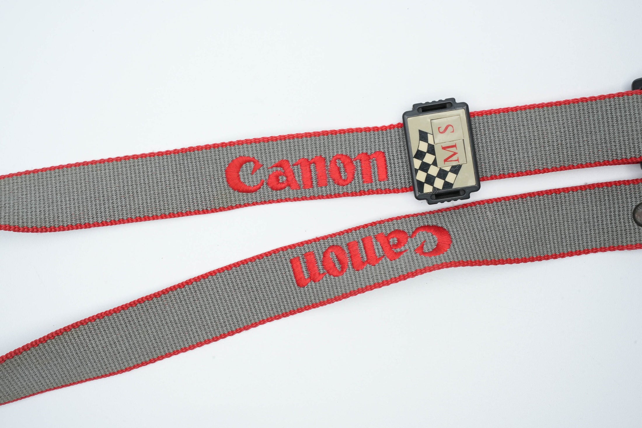 Canon cameraband grijs met rood - Unseend